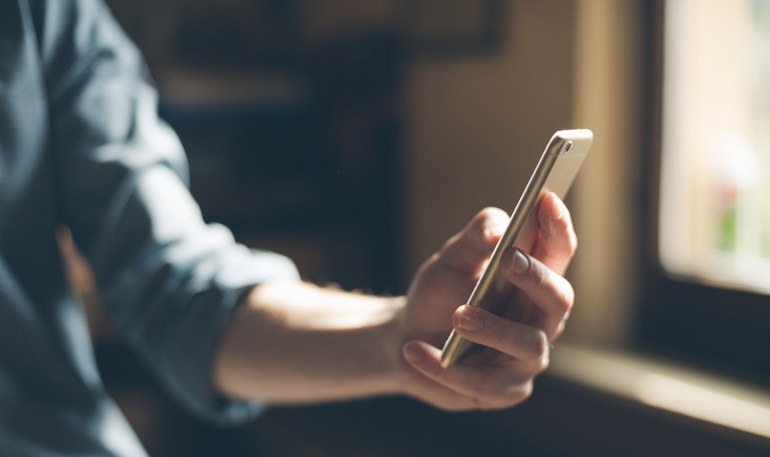 young hipster using a mobile phone