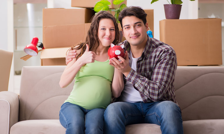 Young couple saving money for baby to be born