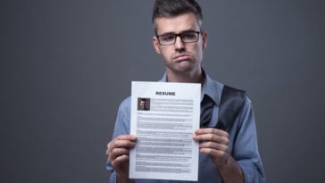 guy holding a resume